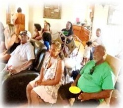 Family relaxing on couches in a den