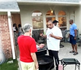Family at the grill in the backyard