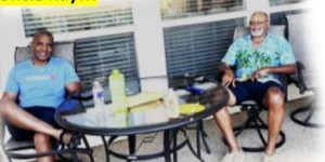 Family sitting around a patio table