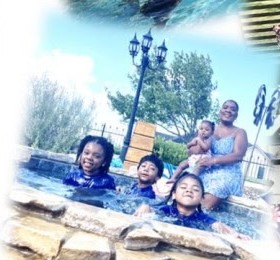 Kids smiling in the pool