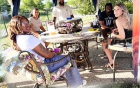 Family talking around an outdoor table