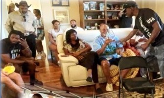 Family gathered in a living room as Uncle Ray is honored