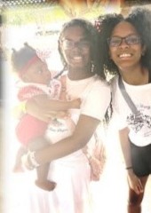 Two young women and a baby