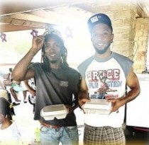 Two young men holding their plates