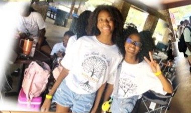 Two young women in reunion T-shirts