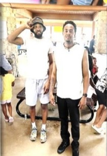 Two young men standing together