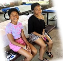 Two girls sitting on a bench