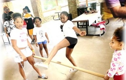 Girls playing a game under the pavilion