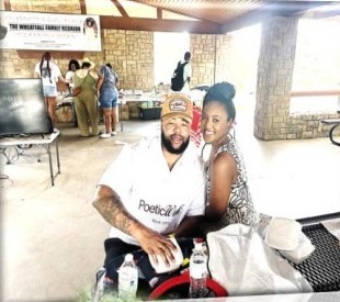 A couple smiling at the reunion