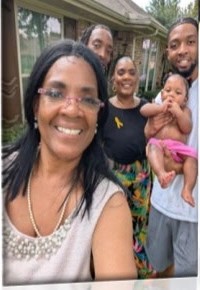 A woman taking a selfie with family