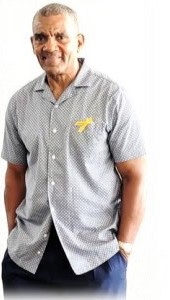 A family member in a grey shirt standing outside