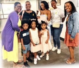 Women and little girls posing at church