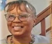 May Helen Wheatfall-Bailey smiling in glasses