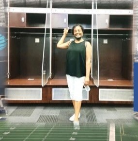 Family member standing in the Cowboys locker room