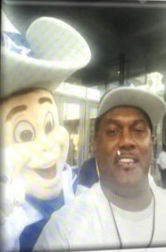 Family member taking a selfie with the Cowboys mascot