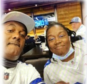 A couple taking a selfie at the stadium